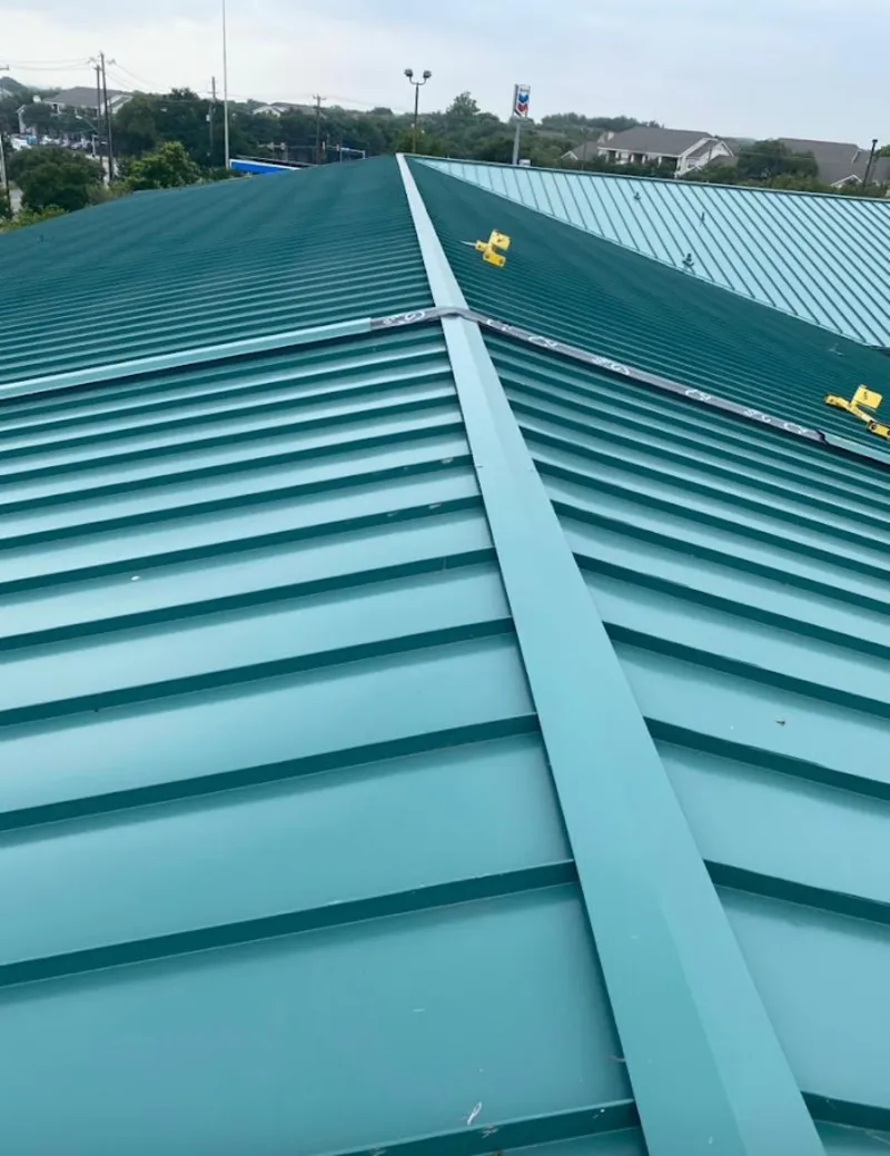 Green commercial metal roof ridge and valley for Metal Roof Repair in Cedar Falls