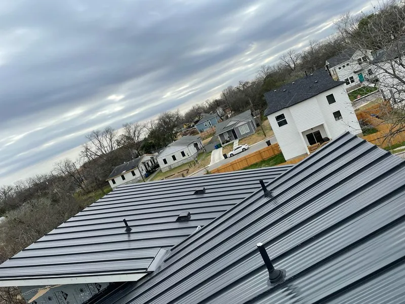 Standing seam metal roof panels with vents for Skylight Repair in Cedar Falls